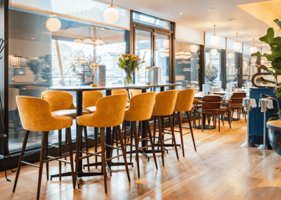 Bespoke café curtains, cushions, and soft furnishings for Côte Brasserie restaurants, combining Parisian charm with durable, stylish design.