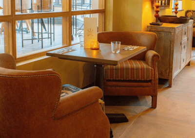 sectors we work with. Pub Interior featuring bespoke bar stools, dining chairs, tables, curtains, and cushions to create a cricket-inspired atmosphere.