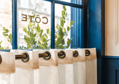 Bespoke café curtains, cushions, and soft furnishings, combining Parisian charm with durable, stylish design.