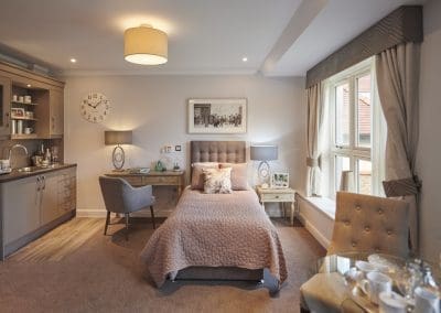 Interior picture of a residential care home, featuring calming and comfortable furniture in a range of rooms, to support senior living.