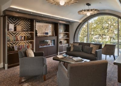 Interior picture of a residential care home, featuring calming and comfortable furniture in a range of rooms, to support senior living.